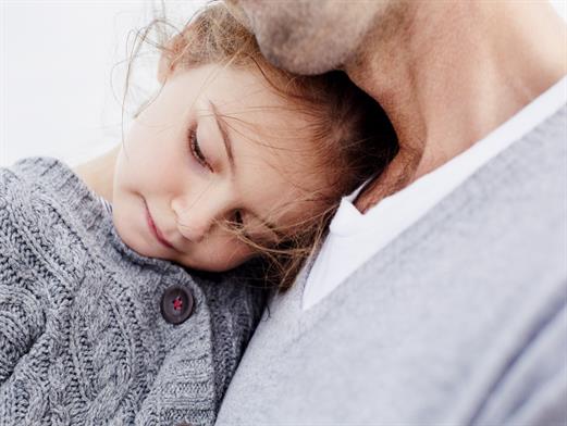 Father holding daughter